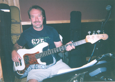 Bass guitar keeps that bass humming Dow Tomlin 